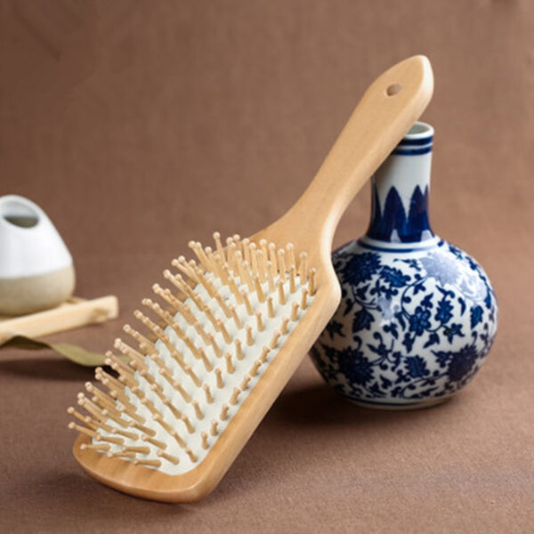 Eco-friendly anti-static wooden brush perfect for thick, thin, curly, or straight hair