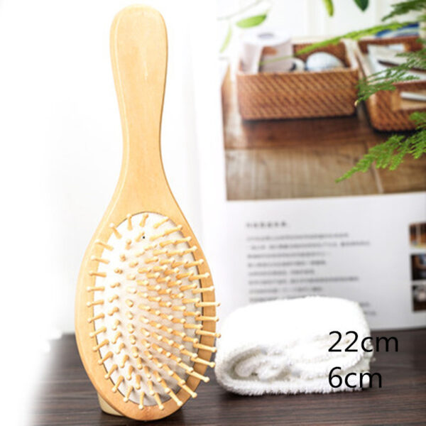 Woman using wooden hair brush to gently massage scalp and reduce tension